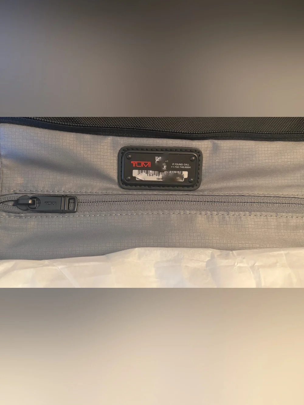 Tumi impressive 13